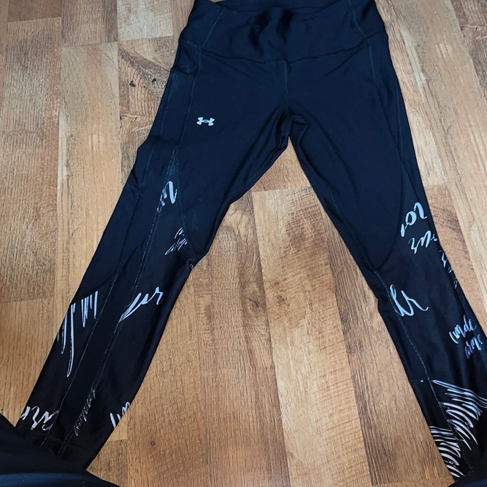Black capri compression leggings, with white scribbles on the bottom of the leg